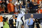 DENVER, CO - SEPTEMBER 12:  Marcel Reece #45 of the Oakland Raiders celebrates his touchdown during the game against the Denver Broncos at Sports Authority Field at Mile High on September 12, 2011 in Denver, Colorado.  (Photo by Garrett W. Ellwood/Getty Images)