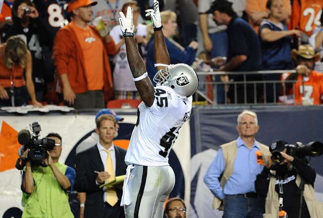 DENVER, CO - SEPTEMBER 12:  Marcel Reece #45 of the Oakland Raiders celebrates his touchdown during the game against the Denver Broncos at Sports Authority Field at Mile High on September 12, 2011 in Denver, Colorado.  (Photo by Garrett W. Ellwood/Getty Images)