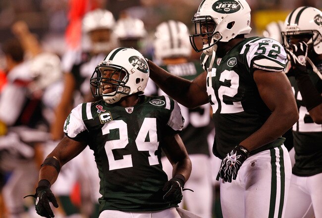 EAST RUTHERFORD, NJ - SEPTEMBER 11:  Darrelle Revis #24 and David Harris #52 of the New York Jets celebrate after Revis intercepted a pass in the fourth quarter against the Dallas Cowboys during their NFL Season Opening Game at MetLife Stadium on September 11, 2011 in East Rutherford, New Jersey.  (Photo by Jeff Zelevansky/Getty Images)