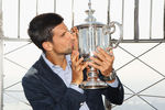 NEW YORK, NY - SEPTEMBER 13:  2011 US Open Singles Men's Champion Novak Djokovic of Serbia poses with his trophy atop the Empire State Building on September 13, 2011 in New York City, New York. Djokovic defeated Rafael Nadal of Spain in 4 sets during their match on September 12, 2011 at the USTA Billie Jean King National Tennis Center.  (Photo by Mike Stobe/Getty Images for ATP)