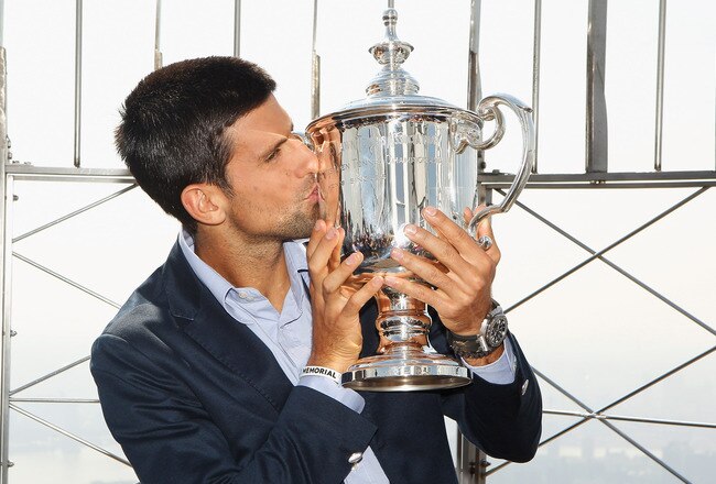 NEW YORK, NY - SEPTEMBER 13:  2011 US Open Singles Men's Champion Novak Djokovic of Serbia poses with his trophy atop the Empire State Building on September 13, 2011 in New York City, New York. Djokovic defeated Rafael Nadal of Spain in 4 sets during their match on September 12, 2011 at the USTA Billie Jean King National Tennis Center.  (Photo by Mike Stobe/Getty Images for ATP)