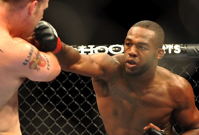 LAS VEGAS - JULY 11:  (R-L) Jon Jones connects with a right punch on Jake O'Brein during their light heavyweight bout during UFC 100 on July 11, 2009 in Las Vegas, Nevada. Jones defeated O'Brein by second round tapout.  (Photo by Jon Kopaloff/Getty Images)
