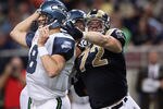 ST. LOUIS - OCTOBER 03:  Chris Long #72 of the St. Louis Rams pressures Matt Hasselbeck #8 of the Seattle Seahawks on October 3, 2010 at Edward Jones Dome in St. Louis, Missouri. The Rams defeated the Seahawks 20-3.  (Photo by Elsa/Getty Images)