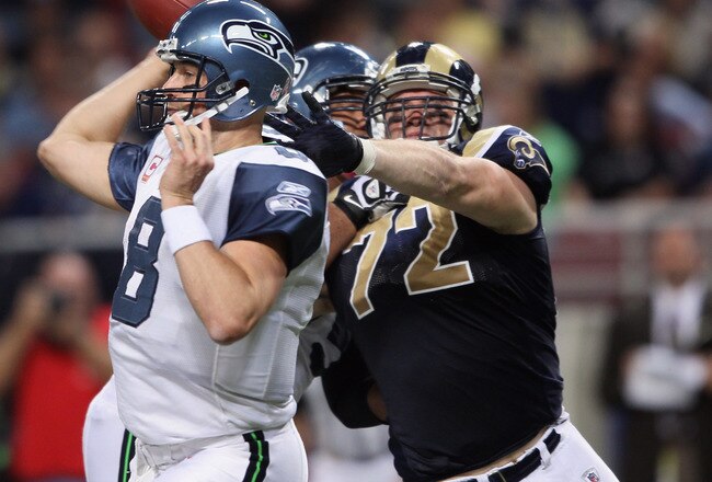 ST. LOUIS - OCTOBER 03:  Chris Long #72 of the St. Louis Rams pressures Matt Hasselbeck #8 of the Seattle Seahawks on October 3, 2010 at Edward Jones Dome in St. Louis, Missouri. The Rams defeated the Seahawks 20-3.  (Photo by Elsa/Getty Images)