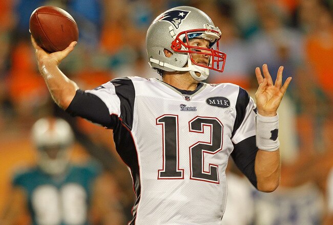 MIAMI GARDENS, FL - SEPTEMBER 12:  Tom Brady #12 of the New England Patriots passes during a game against the Miami Dolphins at Sun Life Stadium on September 12, 2011 in Miami Gardens, Florida.  (Photo by Mike Ehrmann/Getty Images)