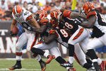 CLEVELAND, OH - SEPTEMBER 11:  Running back Peyton Hillis #40 of the Cleveland Browns is tackled by defensive players of the Cincinnati Bengals during the season opener  at Cleveland Browns Stadium on September 11, 2011 in Cleveland, Ohio.  (Photo by Matt Sullivan/Getty Images)