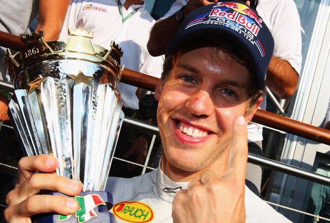 MONZA, ITALY - SEPTEMBER 11:  Sebastian Vettel of Germany and Red Bull Racing celebrates with the winning drivers trophy following the Italian Formula One Grand Prix at the Autodromo Nazionale di Monza on September 11, 2011 in Monza, Italy.  (Photo by Mark Thompson/Getty Images)