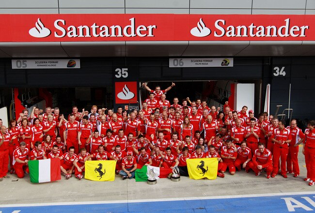 NORTHAMPTON, UNITED KINGDOM - JULY 10:  Fernando Alonso of Spain and Ferrari celebrates with team mates in the pitlane after winning the British Formula One Grand Prix at the Silverstone Circuit on July 10, 2011 in Northampton, England.  (Photo by Paul Gilham/Getty Images)