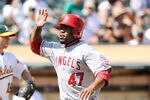 OAKLAND, CA - SEPTEMBER 14: Howie Kendrick #47 of the Los Angeles Angels of Anaheim scores on a Bob Abreu double against the Oakland Athletics in the six inning during an MLB baseball game at O.co Coliseum on September 14, 2011 in Oakland, California.  (Photo by Thearon W. Henderson/Getty Images)