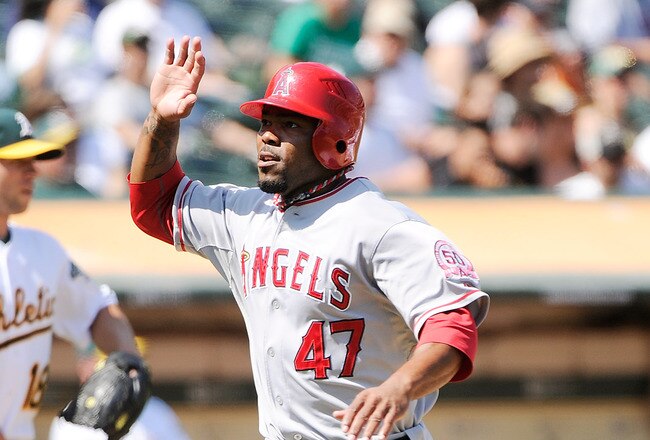 OAKLAND, CA - SEPTEMBER 14: Howie Kendrick #47 of the Los Angeles Angels of Anaheim scores on a Bob Abreu double against the Oakland Athletics in the six inning during an MLB baseball game at O.co Coliseum on September 14, 2011 in Oakland, California.  (Photo by Thearon W. Henderson/Getty Images)