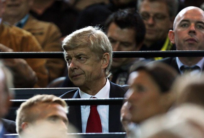 DORTMUND, GERMANY - SEPTEMBER 13:  Arsenal manager Arsene Wenger looks on from the stands during the UEFA Champions League Group F match between Borussia Dortmund and Arsenal FC at Signal Iduna Park on September 13, 2011 in Dortmund, Germany.  (Photo by Ian Walton/Getty Images)