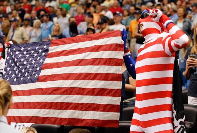 ST. PETERSBURG, FL - SEPTEMBER 11:  Fans of the Tampa Bay Rays celebrate during the singing of God Bless America during the game against the Boston Red Sox at Tropicana Field on September 11, 2011 in St. Petersburg, Florida.  (Photo by J. Meric/Getty Images)