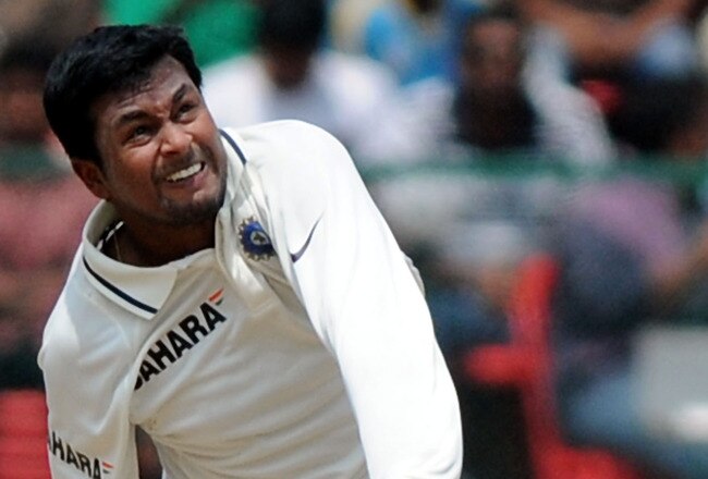 BANGALORE, INDIA - OCTOBER 10:  Pragyan Ojha of India bowls during day two of the Second Test match between India and Australia at M.Chinnaswamy Stadium on October 10, 2010 in Bangalore, India.  (Photo by Pal Pillai/Getty Images)