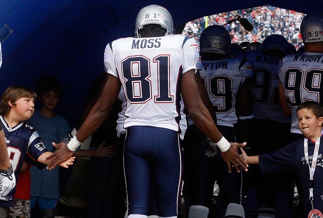 FOXBORO, MA - SEPTEMBER 12: Randy Moss #81 of the New England Patriots enters the field before the NFL season opener against the Cincinnati Bengals at Gillette Stadium on September 12, 2010 in Foxboro, Massachusetts. (Photo by Jim Rogash/Getty Images)