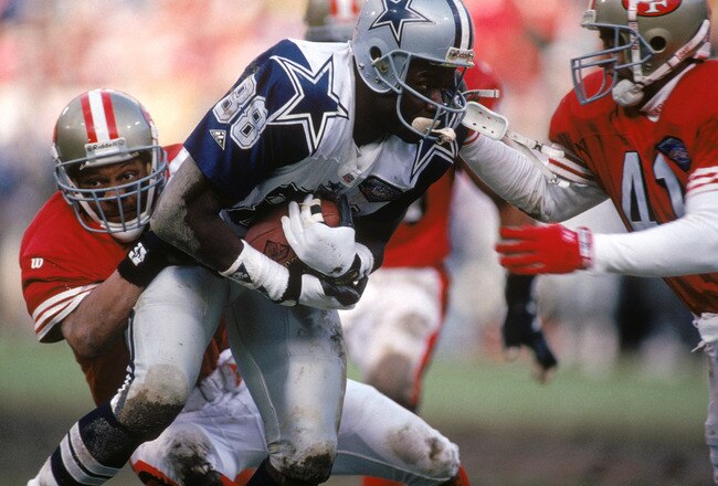 SAN FRANCISCO - JANUARY 15:  Wide receiver Michael Irvin #88 of the Dallas Cowboys gets tackled during the 1994 NFC Conference Championship game against the San Francisco 49ers at Candlestick Park on January 15, 1995 in San Francisco, California.  The 49ers won 38-28.  (Photo by George Rose/Getty Images)