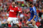 MANCHESTER, ENGLAND - MAY 08:  Wayne Rooney of Manchester United competes with Branislav Ivanovic of Chelsea during the Barclays Premier League match between Manchester United and Chelsea at Old Trafford on May 8, 2011 in Manchester, England.  (Photo by Alex Livesey/Getty Images)