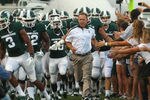 EAST LANSING, MI - SEPTEMBER 02:  Head coach, Mark Dantonio leads his Michigan State Spartans onto the field before an NCAA football game against the Youngstown State Penguins at Spartan Stadium on September 2, 2011 in East Lansing, Michigan.  (Photo by Dave Reginek/Getty Images)
