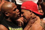 LAS VEGAS, NV - SEPTEMBER 16: (L-R) Boxer Floyd Mayweather Jr. grabs the neck of Victor Ortiz after the weigh-in for their WBC welterweight title fight at the MGM Grand Garden Arena on September 16, 2011 in Las Vegas, Nevada. Mayweather Jr. and Ortiz will meet in a 12-round bout on September 17, 2011 in Las Vegas, Nevada. (Photo by Al Bello/Getty Images)