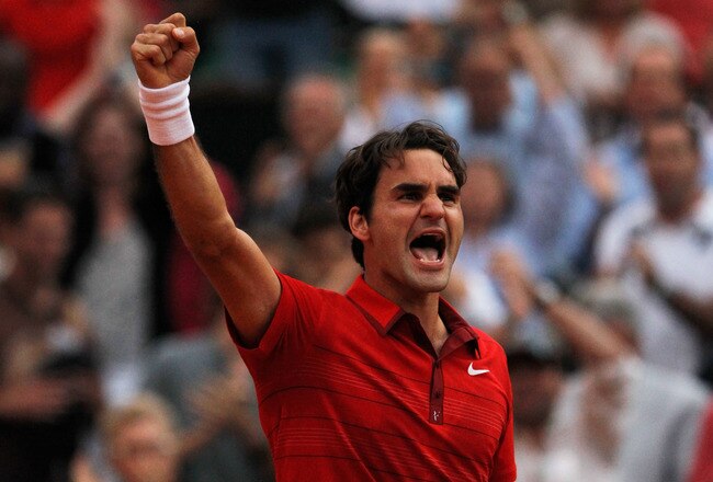 PARIS, FRANCE - JUNE 03:  Roger Federer of Switzerland celebrates match point during the men's singles semi final match between Roger Federer of Switzerland and Novak Djokovic of Serbia on day thirteen of the French Open at Roland Garros on June 3, 2011 in Paris, France.  (Photo by Matthew Stockman/Getty Images)