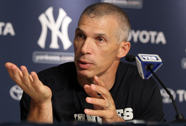 NEW YORK, NY - JULY 08:  Manager Joe Girardi of the New York Yankees speaks to the media after the game against the Tampa Bay Rays was postponed due to rain on July 8, 2011 at Yankee Stadium in the Bronx borough of New York City.  (Photo by Jim McIsaac/Getty Images)
