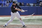 TORONTO, CANADA - SEPTEMBER 17:  Brett Lawrie #13 of the Toronto Blue Jays breaks his bat during MLB game action against the New York Yankees September 17, 2011 at Rogers Centre in Toronto, Ontario, Canada. (Photo by Brad White/Getty Images)
