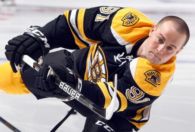 TORONTO, CANADA - DECEMBER 4: Marc Savard #91 of the Boston Bruins shoots before game action against the Toronto Maple Leafs at the Air Canada Centre December 4, 2010 in Toronto, Ontario, Canada. (Photo by Abelimages / Getty Images)