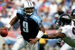 NASHVILLE, TN - SEPTEMBER 18: Quarterback Steve McNair #9 of the Tennessee Titans eludes Antwan Odom #98 of the Baltimore Ravens as the Titans defeated the Ravens 25-10 during NFL action at the Coliseum on September 18, 2005 in Nashville, Tennessee.  (Photo by Doug Pensinger/Getty Images)