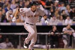 DENVER, CO - SEPTEMBER 17:  Brett Pill #6 of the San Francisco Giants hits a two RBI triple off of Huston Street #16 of the Colorado Rockies in the eighth inning at Coors Field on September 17, 2011 in Denver, Colorado.  (Photo by Doug Pensinger/Getty Images)