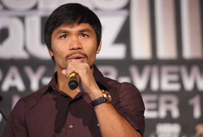 NEW YORK, NY - SEPTEMBER 06:  Professional Boxer Manny Pacquiao (pictured) sings during the press conference for his World Welterweight Championship Fight with Juan Manuel Marquez at The Lighthouse at Chelsea Piers on September 6, 2011 in New York City.  (Photo by Michael Loccisano/Getty Images)