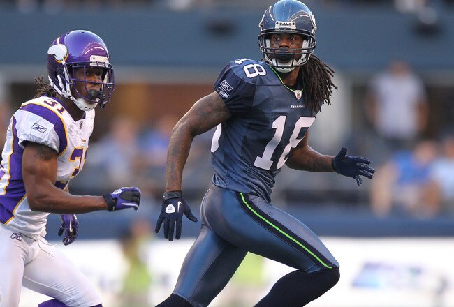 SEATTLE - AUGUST 20:  Wide receiver Sidney Rice #18 of the Seattle Seahawks runs a pass route against cornerback Chris Cook #31 of the Minnesota Vikings at CenturyLink Field on August 20, 2011 in Seattle, Washington. The Vikings won 20-7. (Photo by Otto Greule Jr/Getty Images)