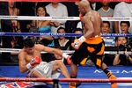 LAS VEGAS, NV - SEPTEMBER 17:  (R-L) Floyd Mayweather Jr. knocks out Victor Ortiz in the fourth round during their WBC welterweight title fight at the MGM Grand Garden Arena on September 17, 2011 in Las Vegas, Nevada.  (Photo by Ethan Miller/Getty Images)