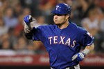 ANAHEIM, CA - AUGUST 16:  Josh Hamilton #32 of the Texas Rangers celebrates his homerun against the Los Angeles Angels at Angel Stadium of Anaheim on August 16, 2011 in Anaheim, California.  (Photo by Harry How/Getty Images)