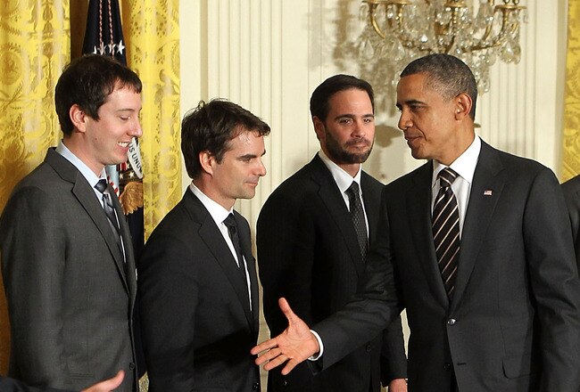 WASHINGTON, DC - SEPTEMBER 07:  U.S. President Barack Obama (C) extends his hand for hand shakes with NASCAR drivers (L-R) Jeff Burton, Kyle Busch, Jeff Gordon, Jimmie Johnson, Denny Hamlin, Matt Kenseth, Kurt Busch, and Clint Bowyer during an East Room event September 7, 2011 at the White House in Washington, DC. Obama hosted the 2010 NASCAR Sprint Cup Series Champion Jimmie Johnson to honor his win. Johnson is the only driver in the NASCAR history to win in five consecutive years.  (Photo by Alex Wong/Getty Images)