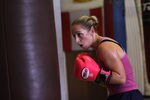 LONDON, ENGLAND - AUGUST 13:  Female boxer Heather Brooks trains in Miguel's Gym in Brixton on August 13, 2009 in London, England. The International Olympic Committee's executive board has today ruled that women's boxing is to be included in the London 2012 Olympic games.  (Photo by Oli Scarff/Getty Images)