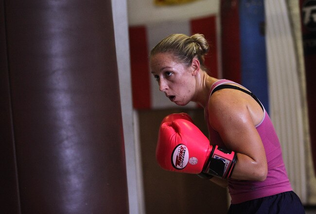 LONDON, ENGLAND - AUGUST 13:  Female boxer Heather Brooks trains in Miguel's Gym in Brixton on August 13, 2009 in London, England. The International Olympic Committee's executive board has today ruled that women's boxing is to be included in the London 2012 Olympic games.  (Photo by Oli Scarff/Getty Images)