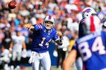 ORCHARD PARK, NY - SEPTEMBER 18:  Ryan Fitzpatrick #14 of the Buffalo Bills throws a pass to  Scott Chandler #84 against the Oakland Raiders at Ralph Wilson Stadium on September18, 2011 in Orchard Park, New York. Buffalo won 38-35.  (Photo by Rick Stewart/Getty Images)
