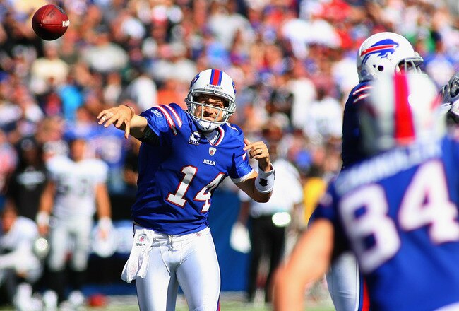 ORCHARD PARK, NY - SEPTEMBER 18:  Ryan Fitzpatrick #14 of the Buffalo Bills throws a pass to  Scott Chandler #84 against the Oakland Raiders at Ralph Wilson Stadium on September18, 2011 in Orchard Park, New York. Buffalo won 38-35.  (Photo by Rick Stewart/Getty Images)