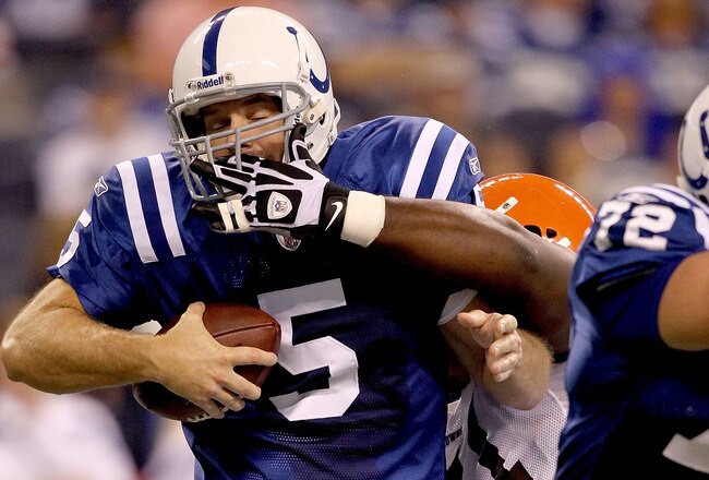 INDIANAPOLIS, IN - SEPTEMBER 18:  Kerry Collins #5 of the Indianapolis Colts is sacked by Artis Hicks #75 of the Cleveland Browns  at Lucas Oil Stadium on September 18, 2011 in Indianapolis, Indiana.  (Photo by Matthew Stockman/Getty Images)