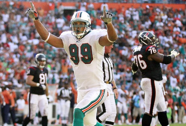 MIAMI GARDENS, FL - SEPTEMBER 18: Defensive end Jason Taylor #99 of the Miami Dolphins celebrates a sack against the Houston Texans at Sun Life Stadium on September 18, 2011 in Miami Gardens, Florida.  (Photo by Marc Serota/Getty Images)