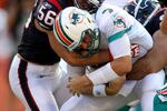 MIAMI GARDENS, FL - SEPTEMBER 18:  Linebackers Brian Cushing #56 and Connor Barwin #98 of the Houston Texans sack Quarterback Chad Henne #7 of  the Miami Dolphins at Sun Life Stadium on September 18, 2011 in Miami Gardens, Florida.  (Photo by Marc Serota/Getty Images)
