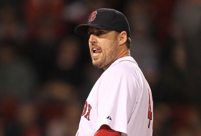 BOSTON, MA - SEPTEMBER 19:  John Lackey #41 of the Boston Red Sox reacts as manager Terry Francona, not seen, walks to mound to remove Lacey during a game with the Baltimore Orioles in the second game of a doubleheader at Fenway Park September 19, 2011 in Boston, Massachusetts. (Photo by Jim Rogash/Getty Images)