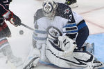 WINNIPEG, CANADA - SEPTEMBER 20: Martin St. Pierre #27 of the Columbus Blue Jackets gives Ondrej Pavelec #31 of the Winnipeg Jets a facewash at the MTS Centre on September 20, 2011 in Winnipeg, Manitoba, Canada. (Photo by Marianne Helm/Getty Images)