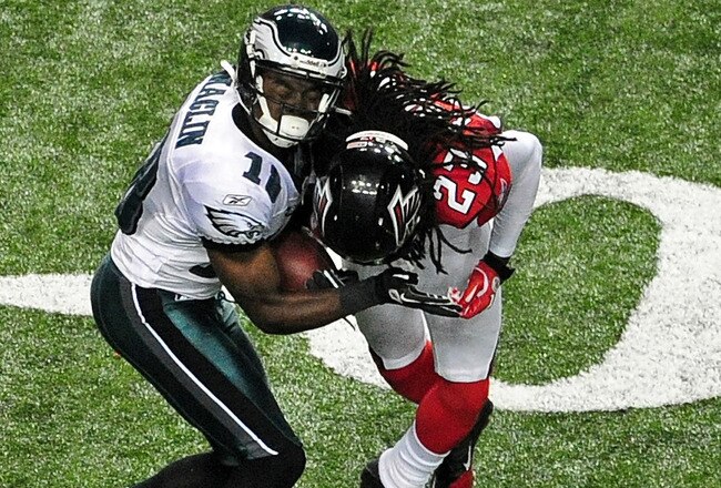 ATLANTA - SEPTEMBER 18: Jeremy Maclin #18 of the Philadelphia Eagles is tackled by Dunta Robinson #23 of the Atlanta Falcons at the Georgia Dome on September 18, 2011 in Atlanta, Georgia. Robinson would be penalized for leading with his helmet. (Photo by Scott Cunningham/Getty Images)