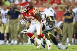 KANSAS CITY, MO - AUGUST 26: Dexter McCluster #22 of the Kansas City Chiefs returns a kick-off against Josh Hull #56 of the St. Louis Rams during a pre-season game at Arrowhead Stadium  on August 26, 2010 in Kansas City, Missouri.  The Rams defeated the Chiefs, 14-10. (Photo by Dilip Vishwanat/Getty Images)