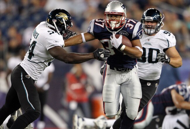 FOXBORO, MA - AUGUST 11:  Richard Medlin #37 of the New England Patriots tries to break from Alvin Bowen #54 of the Jacksonville Jaguars on August 11, 2011 at Gillette Stadium in Foxboro, Massachusetts. The New England Patriots defeated the Jacksonville Jaguars 47-12.  (Photo by Elsa/Getty Images)