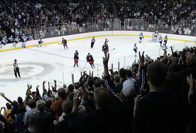 WINNIPEG, CANADA - SEPTEMBER 20: Fans get to their feet with a minute left to celebrate the Winnipeg Jets and their victory  against the Columbus Blue Jackets at the MTS Centre on September 20, 2011 in Winnipeg, Manitoba, Canada. (Photo by Marianne Helm/Getty Images)