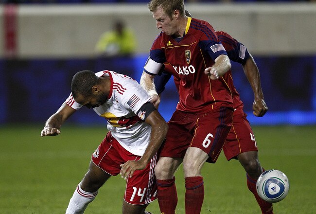 HARRISON, NJ - SEPTEMBER 21:  Thierry Henry  #14 of the New York Red Bulls fights for the ball with Nat Borchers #6 of the Real Salt Lake during their game at Red Bull Arena on September 21, 2011 in Harrison, New Jersey.  (Photo by Jeff Zelevansky/Getty Images)