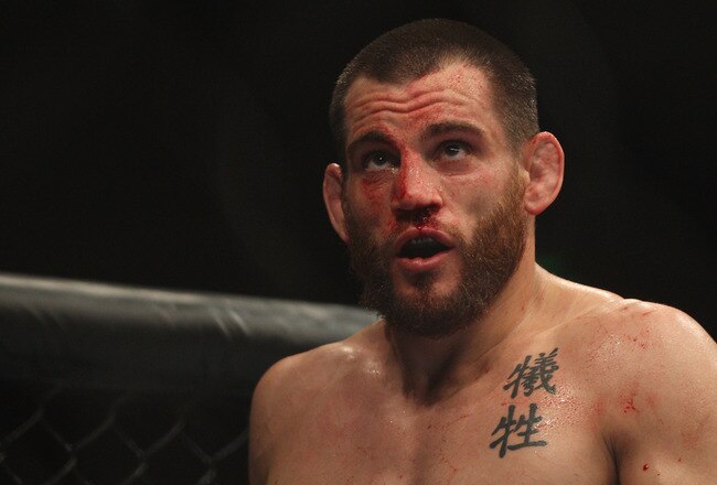 SYDNEY, AUSTRALIA - FEBRUARY 27:  Jon Fitch of the USA looks at the big screen after the first round in his fight against BJ Penn of the USA during their welterweight bout part of  UFC 127 at Acer Arena on February 27, 2011 in Sydney, Australia.  (Photo by Mark Kolbe/Getty Images)