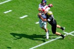 NASHVILLE, TN - SEPTEMBER 17:  Tim Fugger #42 of the Vanderbilt Commodores pressures quarterback Zack Stoudt #8 of the Ole Miss Rebels at Vanderbilt Stadium on September 17, 2011 in Nashville, Tennessee.  (Photo by Grant Halverson/Getty Images)