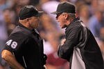 DENVER, CO - SEPTEMBER 09:  Manager Jim Tracy #4 of the Colorado Rockies has words with homeplate umpire Mark Carlson #48 after Carlson ejected Carlos Gonzalez #5 of the Colorado Rockies and subsequently ejecting Tracy in the fifth inning at Coors Field on September 9, 2011 in Denver, Colorado.  (Photo by Doug Pensinger/Getty Images)